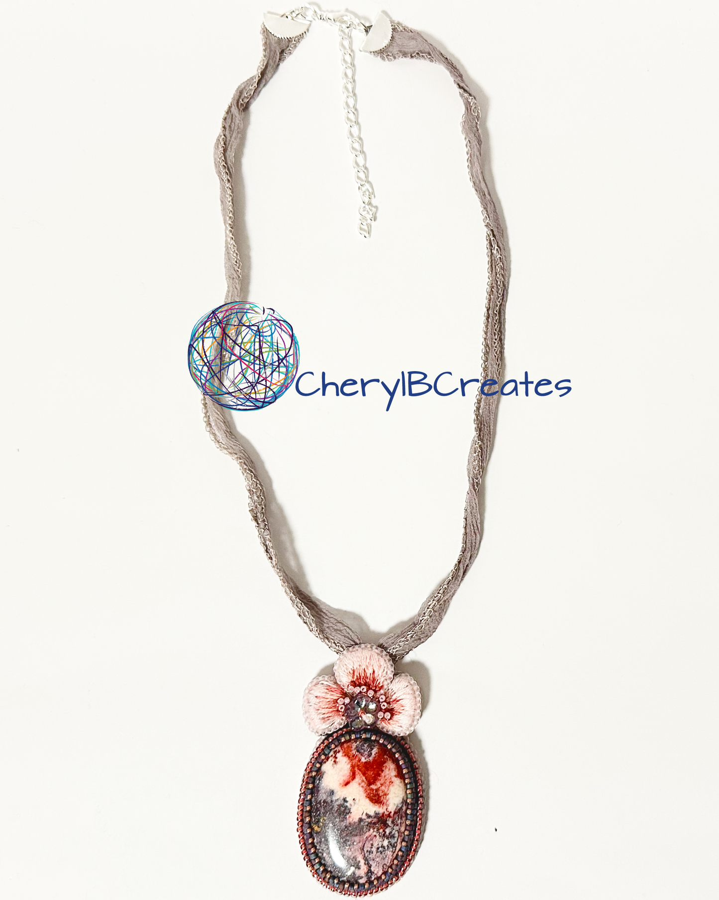 Rhodonite With Hand Embroidered Flower